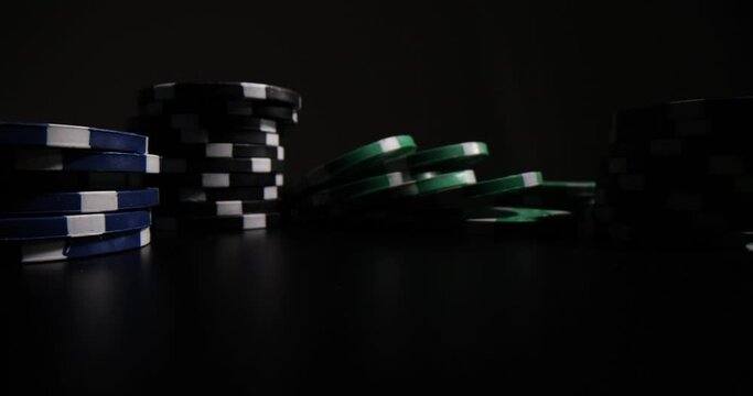 Stacks of poker chips isolated on black background. Gaming and casino