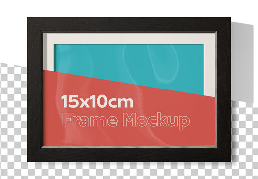 Mockup of horizontal black wood frame 10 x 15 cm with customizable background, mount and shadows