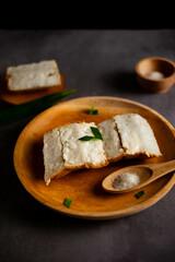 Pancong cake (Kue Pancong) is one of the cakes that is popular as a culinary specialty of the Indonesian Betawi region. Indonesian snack food. served with granulated sugar.
