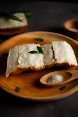 Pancong cake (Kue Pancong) is one of the cakes that is popular as a culinary specialty of the Indonesian Betawi region. Indonesian snack food. served with granulated sugar.