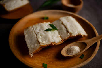 Pancong cake (Kue Pancong) is one of the cakes that is popular as a culinary specialty of the Indonesian Betawi region. Indonesian snack food. served with granulated sugar.
