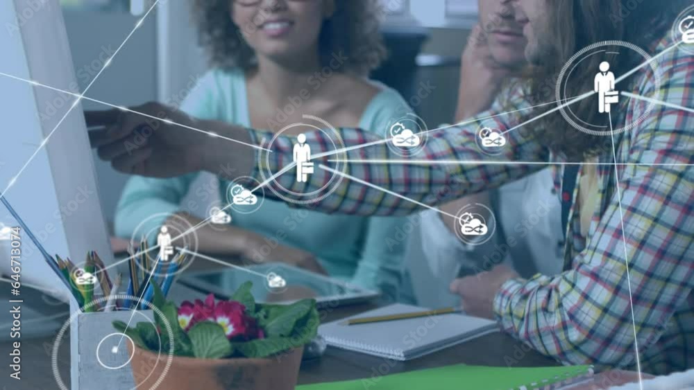 Poster animation of network of digital icons over diverse colleagues discussing over a computer at office