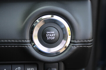 Close up of an engine start stop button - obrazy, fototapety, plakaty