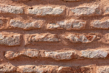 Background of orange brick wall. Up close