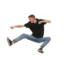 Overcoming difficulties. Young man jumping in fighting pose isolated on white background. Concept of youth, active lifestyle, motivation, emotions and facial expression. Ad