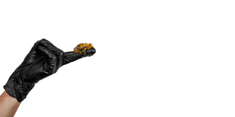 Sugar paste on a hand in a black glove. Poster, copy space. Sugaring salon