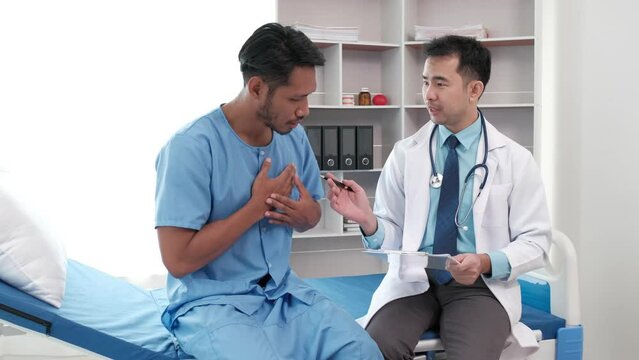 Doctor with clipboard and young man patient meeting at hospital, healthcare and people concept