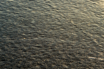 Natural rough frost-covered icy surface of the lake, sea. Beautiful winter landscape. Cracks in the ice. Frozen lake