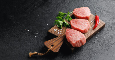 Raw Steak Fresh meat veal fillet on wooden board, dark background top view - obrazy, fototapety, plakaty