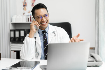 Male medicine doctor, physician or practitioner involved in cellphone call conversation giving professional consultation to patients. Medic tech concept.