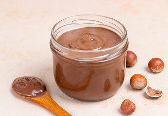 Chocolate paste with nuts in a jar. Dessert. Vegetarian food.