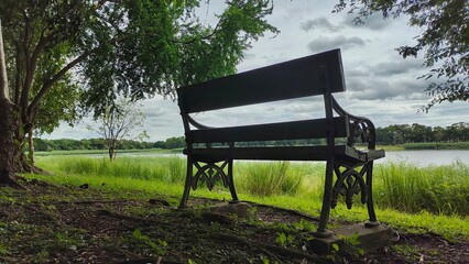 old wooden romantic bench abandoned in nature away from the city, bench to observe nature, recharge your batteries and meditate