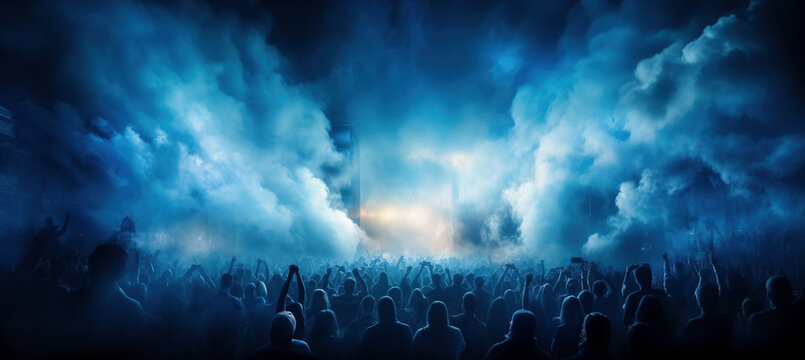 Energetic concert crowd, lost in music, amid blue smoke, creating an electrifying atmosphere.