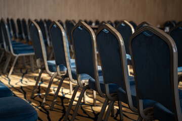 Rows of chairs are lined up in the living room