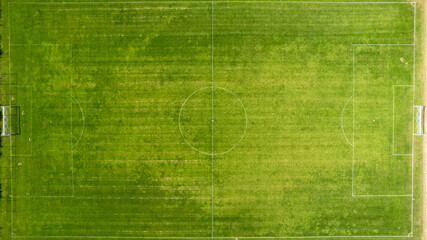 Top view stripe grass soccer field. Green lawn with white lines pattern background. High quality photo