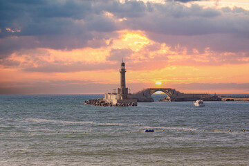 Fototapeta premium Magical Sunset Over Montaza Palace Lighthouse, Mediterranean Sea, Alexandria, Egypt