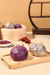 Chinese bean buns made from cereals and grains (purple sweet potato, black rice, red beans, red dates, peanuts), traditional Chinese snacks, healthy breakfast