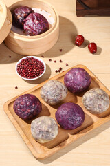 Chinese bean buns made from cereals and grains (purple sweet potato, black rice, red beans, red dates, peanuts), traditional Chinese snacks, healthy breakfast