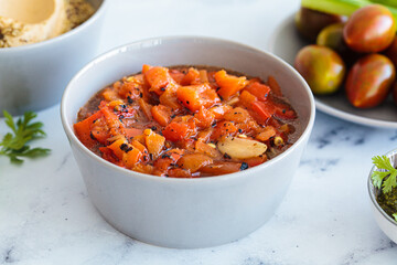 Roasted red pepper salad with garlic. Israeli cuisine concept. Vegetarian recipe