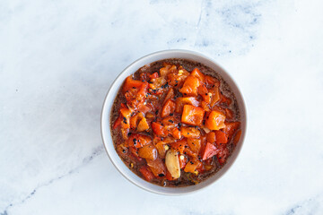 Roasted red pepper salad with garlic. Israeli cuisine concept. Vegetarian recipe