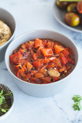 Roasted red pepper salad with garlic. Israeli cuisine concept. Vegetarian recipe