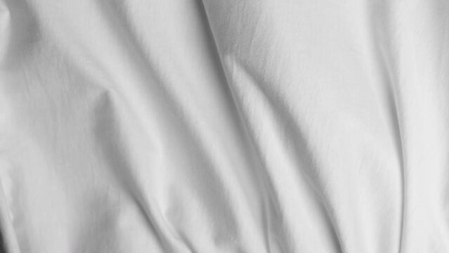 White fabric blowing in slow motion