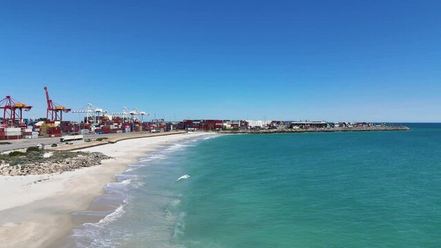 Port beach in Fremantle Western Australia with crystal clear waters around the shipping docks.