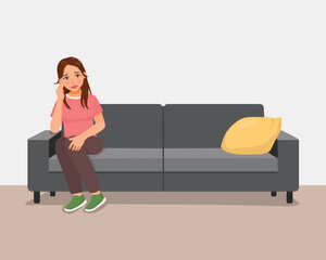 Woman feeling sad and lonely sitting on couch at home