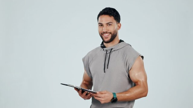 Fitness, invite and man on tablet in studio for exercise, training and workout for wellness app. Sports, hey you and portrait of person on digital tech pointing for gym sign up on gray background