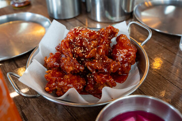 caramelise Korean sweet and spicy fried chicken also known as yangneom chicken