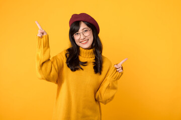 young Asian woman in her 30s, wearing a yellow shirt and red beret. happy face and pointing finger...