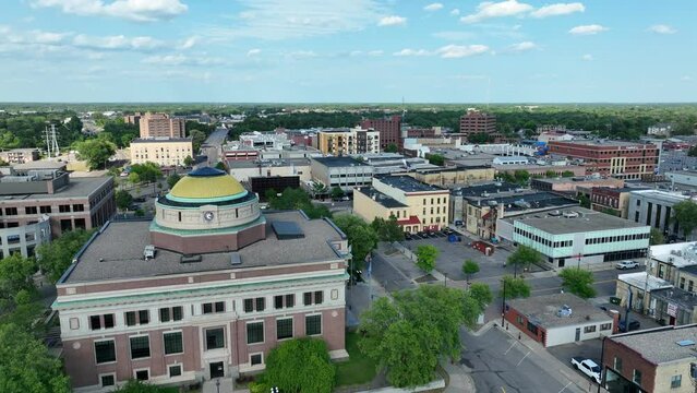 Stearns County Courthouse in Saint Cloud, Minnesota. Small town in MN. Aerial rising shot on summer day.