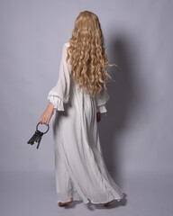 Full length portrait of blonde woman  wearing  white historical bridal gown fantasy costume dress....