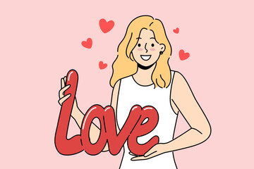 Woman demonstrates word love form of balloon, congratulating you on Valentine day or february 14th. Romantic girl confesses love to boyfriend and looks at screen smiling, offering to become couple