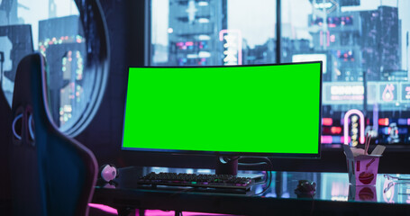 Empty Futuristic Cyberpunk Room with Neon Lights with a Professional Gaming Station. Ultra Wide Curved Monitor with Green Screen Mock Up Display Standing on a Stylish Glass Table © Gorodenkoff