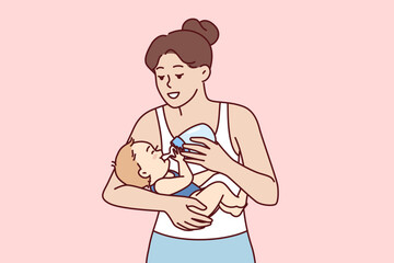 Young mother feeds infant from bottle using artificial baby food fortified with vitamins due to disease hypogalactia. Happy mom takes care of son or daughter and gives baby milk from pacifier
