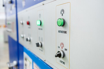 Power button on panel control machine. Pressing work button. Engineering are working on turning on machines in industrial plants.