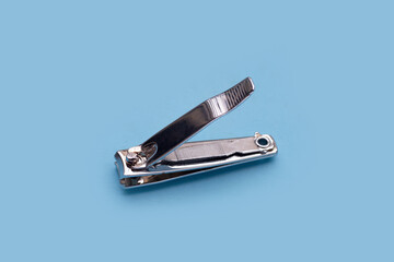 Nail clippers on blue background.