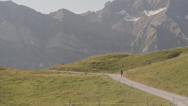 Rear View of A Hiker On the GR5 - GTA With Alps Mountain Background - Static Wide