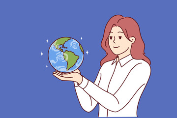 Business woman holding miniature planet earth dreaming of starting international company or global business. Girl with smile looks at globe with continents and dreams of going on trip around world.