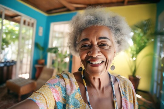 Senior black woman taking selfie at home