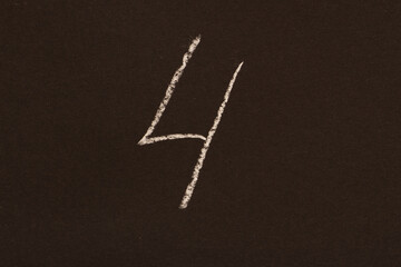 Number four drawn in chalk on a black background, minimalist style.