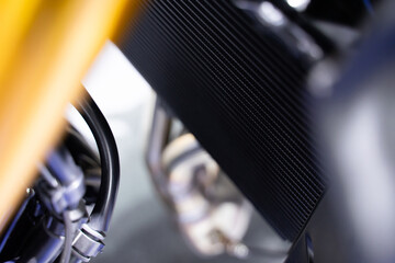 Motorcycle air filter panel, blurred background - obrazy, fototapety, plakaty