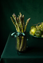 Green fruits and vegetables on a green table 