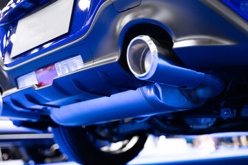 View of the rear of the car, details about the suspension. , blue super sports exhaust pipe, luxury car