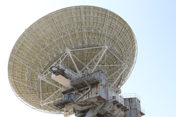 abandoned satellite dish in the forest close-up detailed.