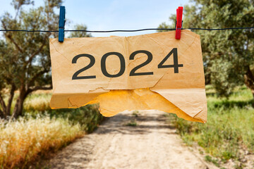 hanging enveloppe with New year 2024 or 2024 planning concept of success beginning. New year plan, goals, challenges, resolution