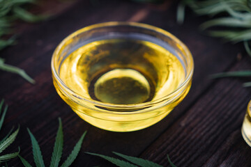 CBD oil on wood background, Cannabis Oil. medical marijuana concept