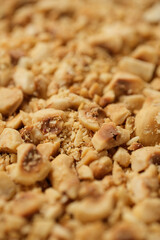 Ground roasted hazelnuts close up