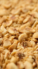 Heap of ground roasted hazelnuts close up